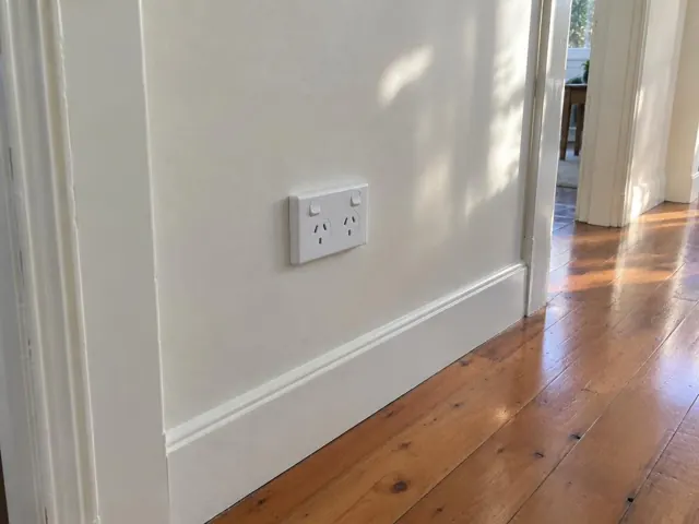 White double power point on a painted wall with timber floor and skirting in Point Frederick